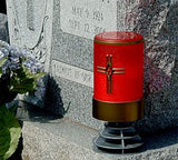 red  flameless LED battery operated electric candle with cross on a  memorial headstone