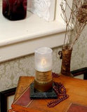 white flickering LED remembrance candle on wood table